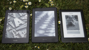 The new Paperwhite sits in the centre, with the Voyage to its left and the Kobo Glo HD to the right