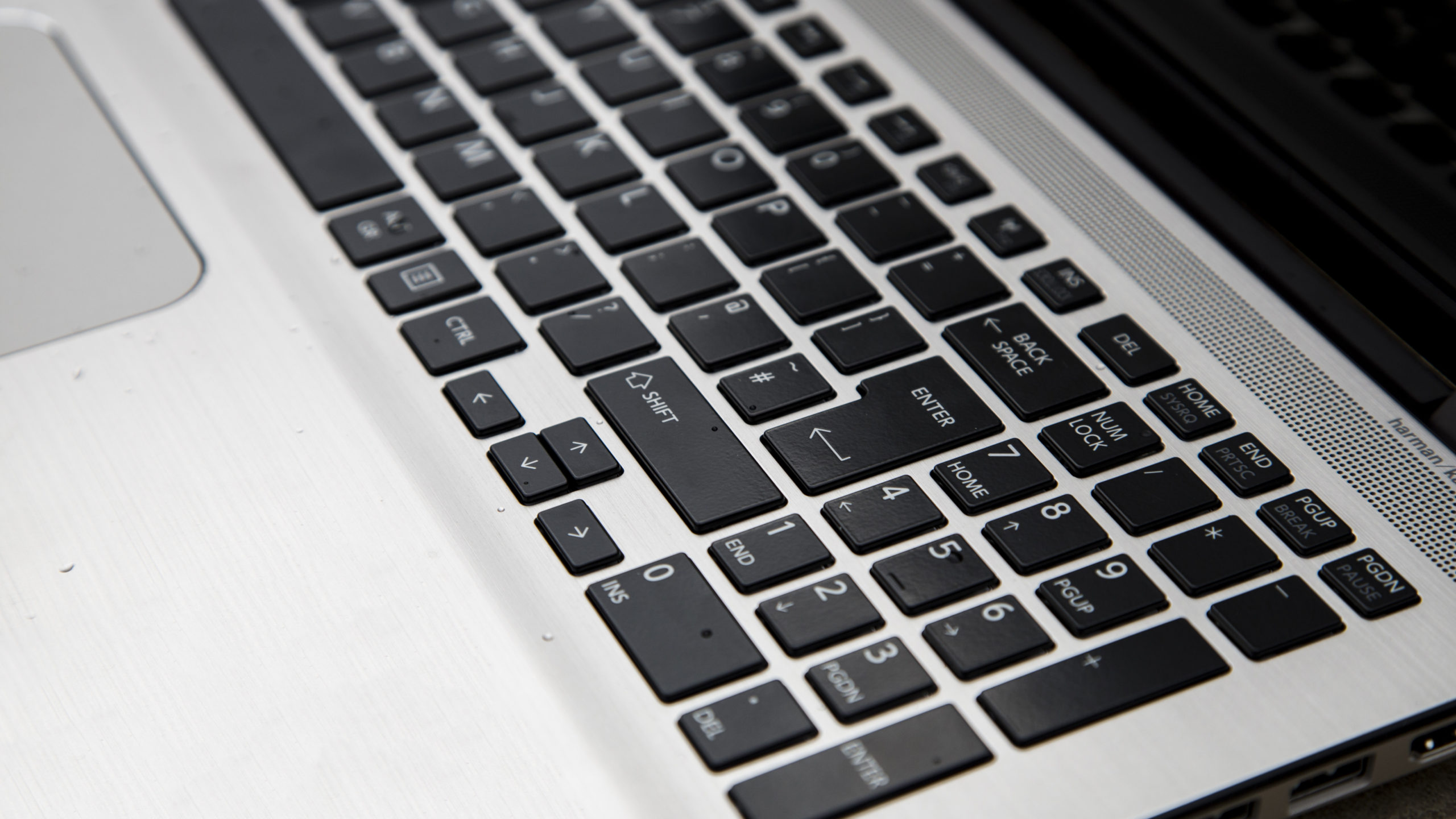 Toshiba Satellite Radius 15 review: Harmon Kardon-branded speakers run along the top of the keyboard