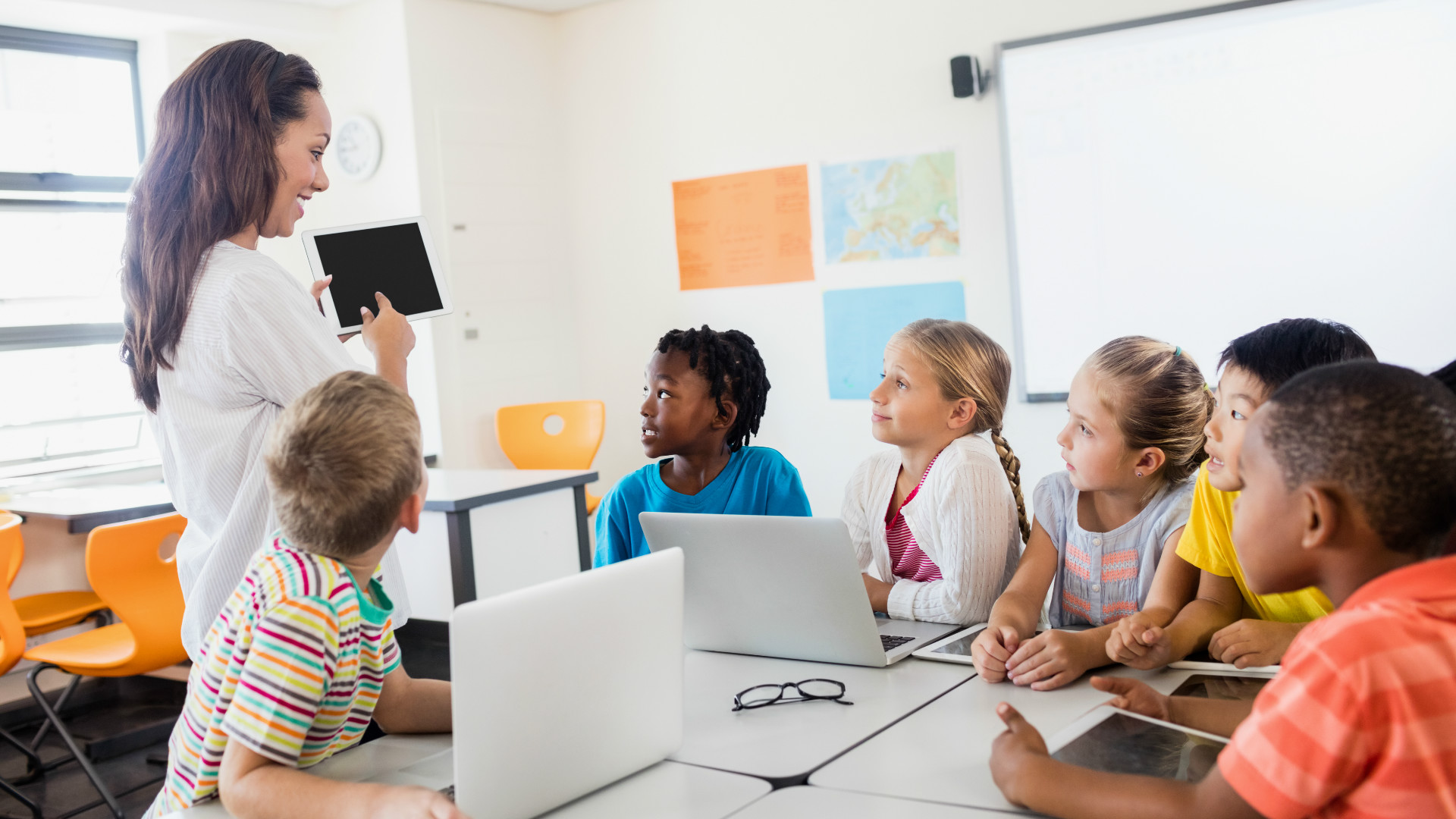 classroom_teacher_students_tablet_laptops