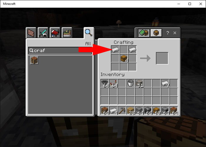 Placing two Iron Ingots in the top corners of the crafting grid in Minecraft
